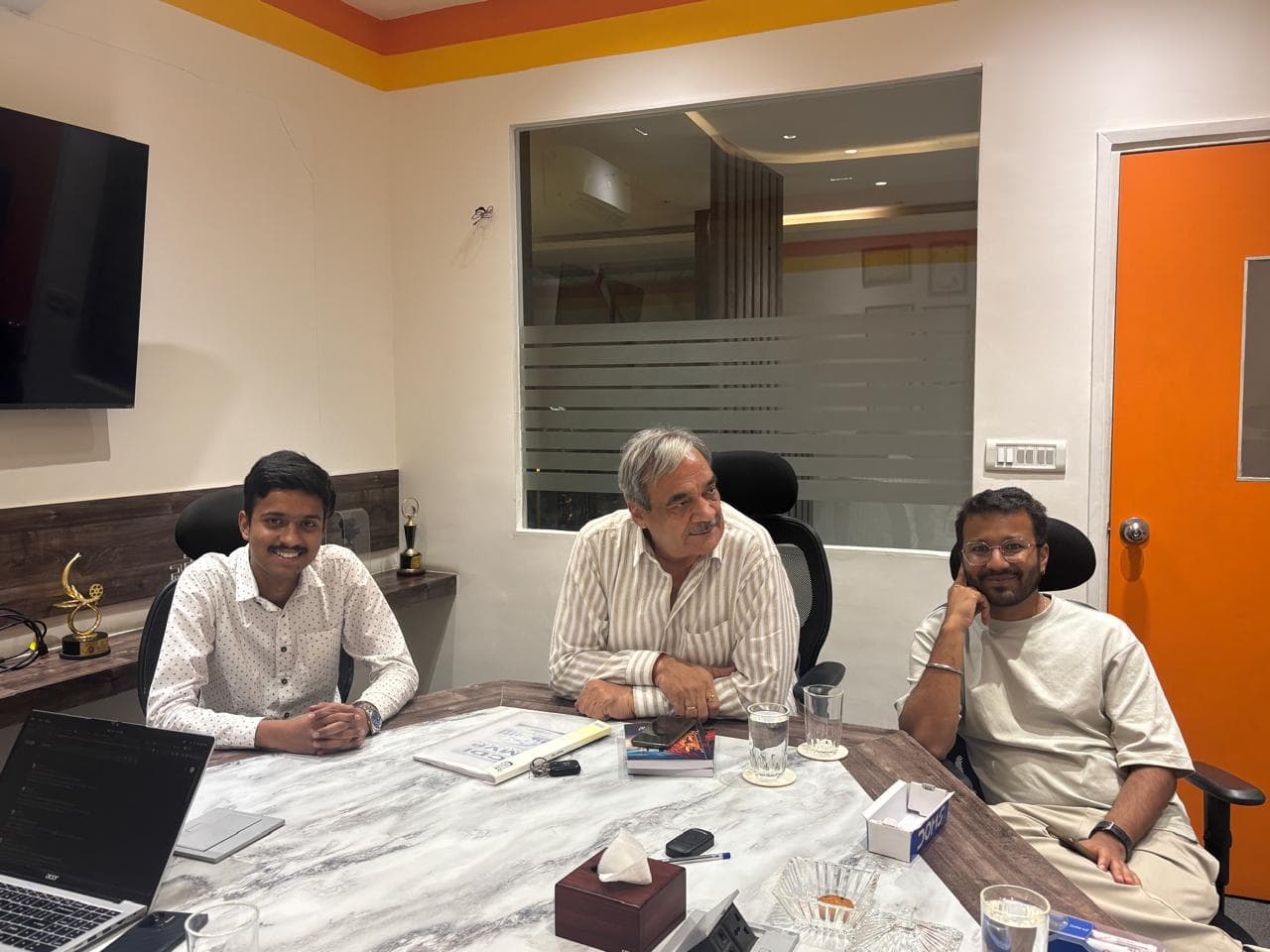 Kotnala consultants collaborating in an engineering workspace.